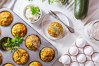 Homemade zucchini muffins with feta cheese and herbs Stock Photo