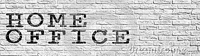 HOMEOFFICE background banner - Rustic old white painted brick stone wall masonry brickwork stonework texture with black font Stock Photo