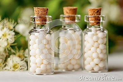 Homeopathy globules in bottles. Homeopathy, naturopathy and alternative medicine Stock Photo