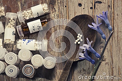 Homeopathy globules in hand Stock Photo