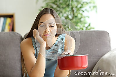 Homeowner watching ceiling leaks at home Stock Photo