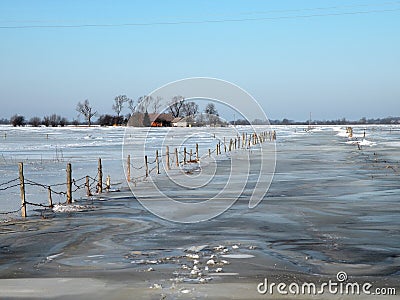 Homestead in field in flood Stock Photo