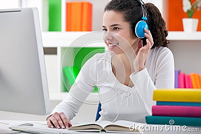 Homework with headphones Stock Photo