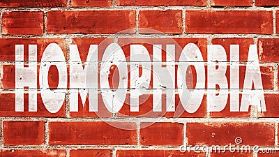 Homophobia Written On A Brick Wall Stock Photo