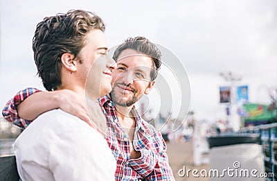 Homosexual couple sitting in Santa monica pier on a bench Stock Photo