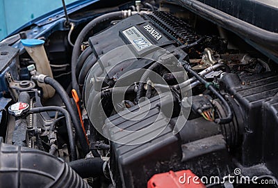 Honda IMA engine system in a used hybrid car Editorial Stock Photo