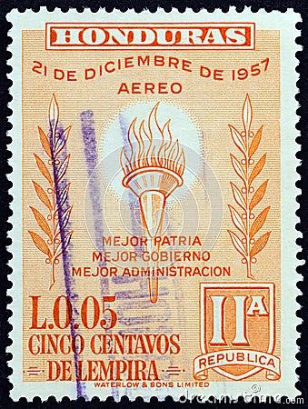 HONDURAS - CIRCA 1959: A stamp printed in Honduras issued for the 2nd Anniversary of New Constitution shows Flaming torch Editorial Stock Photo