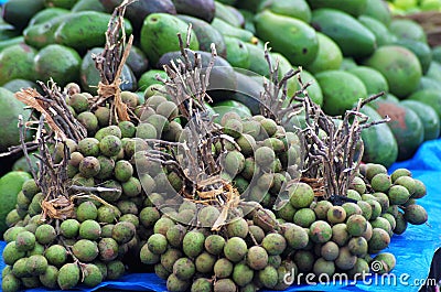 Honduras market exotic fruit suckers fruit Mamones Stock Photo
