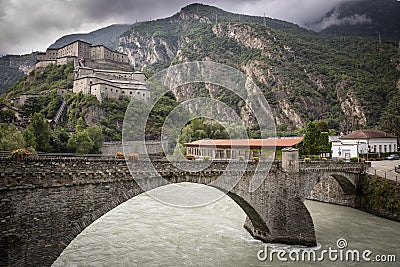 Hone/Bard old bridge over Dora Baltea river and the Bard fortress Stock Photo