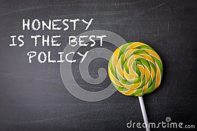 Honesty is The Best Policy. Text on a dark chalk board Stock Photo