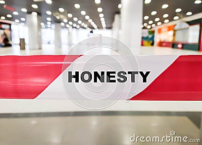 HONESTY word on red and white dividing ribbon Stock Photo