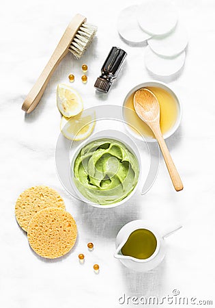 Honey and avocado face mask on light background, top view. Beauty, youth, skin care concept. Stock Photo