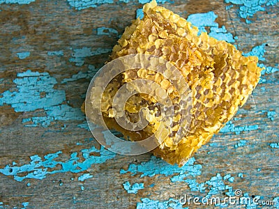 Honey background. Sweet honey in the comb . On rural wooden background. Glass bank with honey Stock Photo