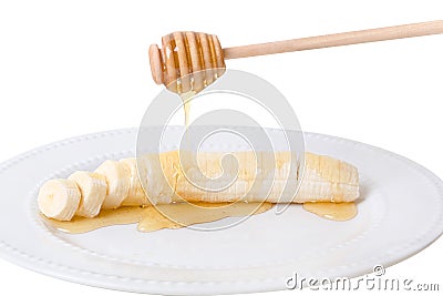 Honey On A Banana With Wood Drizzler Stock Photo