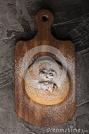 Honey biscuits with a walnut kernel on a wooden cutting board made from walnut wood. Stock Photo