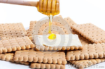 Honey and butter on classics crackers Stock Photo