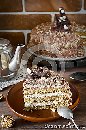 Honey cake with walnuts and grated chocolate Stock Photo