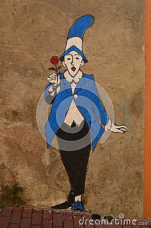 Man in blue and black suit with red rose, street Art Spain Editorial Stock Photo