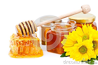 Honey dipper and honeycomb Stock Photo