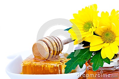 Honey dipper and honeycomb Stock Photo