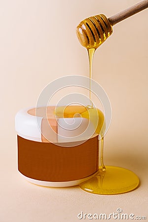 Honey drips into natural spa formula for skincare Stock Photo