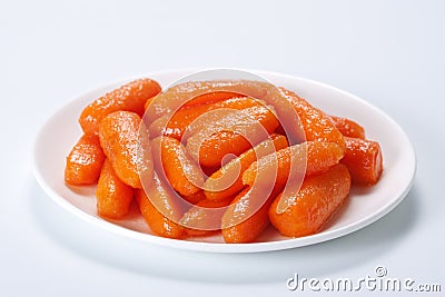 Honey glazed baby carrots Stock Photo