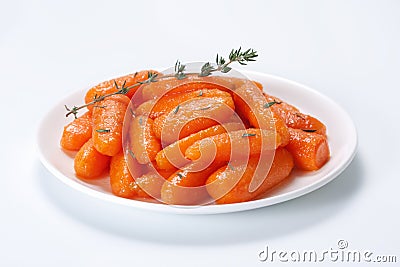 Honey glazed baby carrots Stock Photo