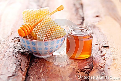 Honey with honey comb Stock Photo