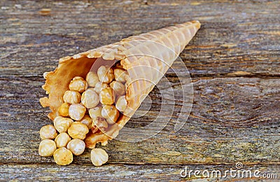 Honey peanuts closeup in sugar cones Stock Photo