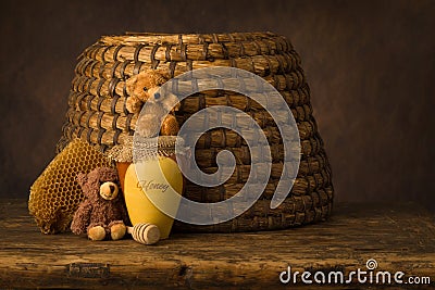 Honey pot and old beehive Stock Photo