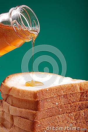 Honey pouring Stock Photo