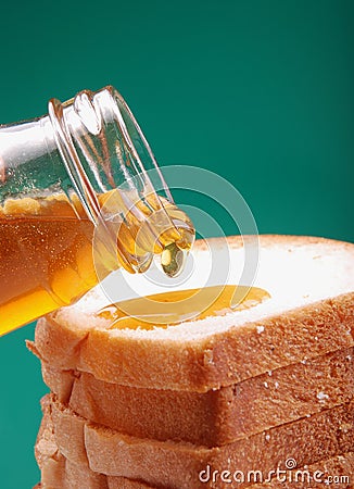 Honey pouring Stock Photo