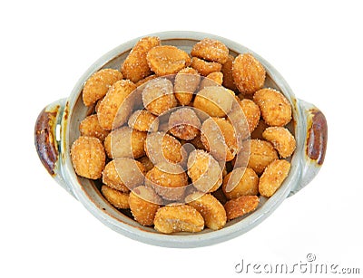 Honey roasted peanuts in small dish Stock Photo