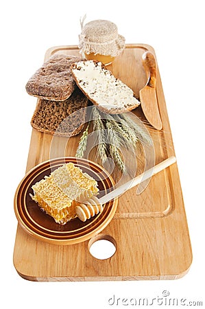 Honey, spike and bread on table Stock Photo