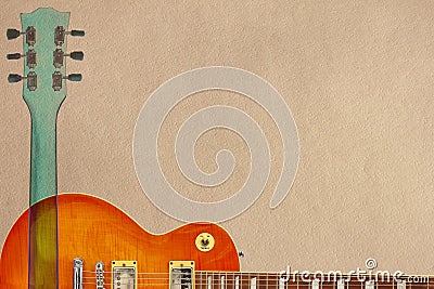 Honey sunburst electric guitar and neck on rough cardboard background, with plenty of copy space. Stock Photo