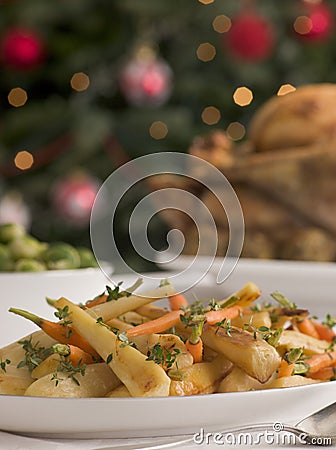 Honey and Thyme Roasted Parsnips and Baby Carrots Stock Photo