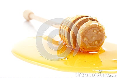 Honey and wooden drizzler Stock Photo