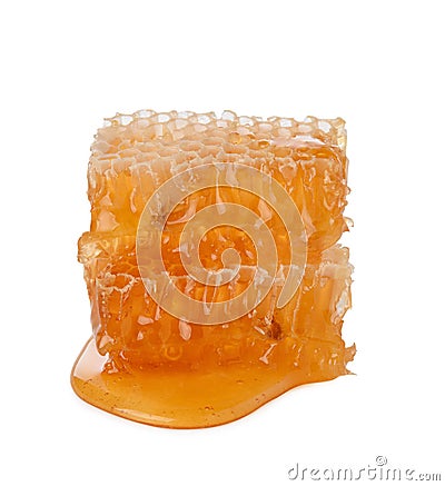 Honeycomb isolated single piece with liquid honey on white background Stock Photo