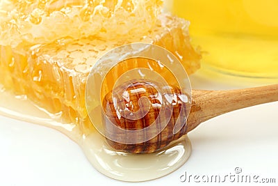 Honeycomb and wooden stick Stock Photo