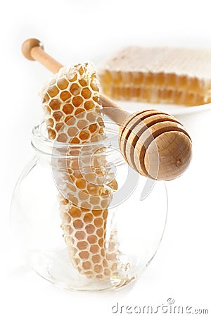 Honeycomb and wooden stick Stock Photo