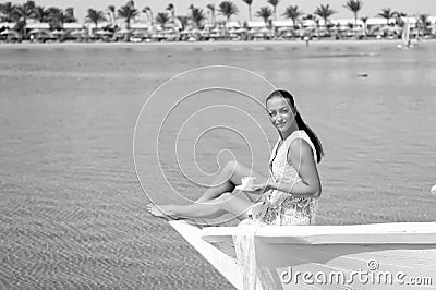 Honeymoon cruise ship. Wedding ceremony sea cruise. Bride adorable white wedding dress sunny day sit on boat or ship Stock Photo