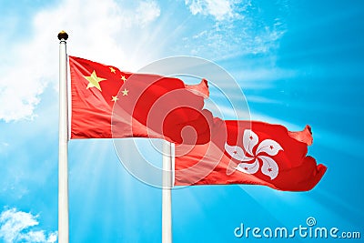 Hong Kong and China flags are fluttering in the breeze Stock Photo