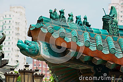 Traditional historical roof decoration detail of the Sik Sik Yuen Wong Tai Sin temple at Kowloon in Hong Kong, China. Editorial Stock Photo