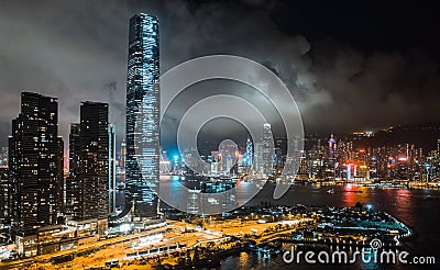 Hong Kong cityscape at night, skyscrapers and tall buildings at Victoria Harbour, drone aerial view Editorial Stock Photo