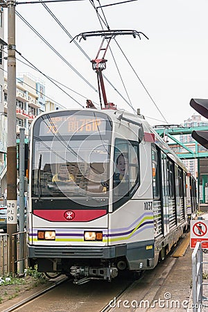 Hong Kong MTR Light Rail. The system operates over 1435mm standard gauge gauge track in Hong Kong. Editorial Stock Photo