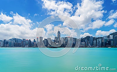 Hong Kong Downtown skyline and Victoria Harbour with blue sky. F Stock Photo