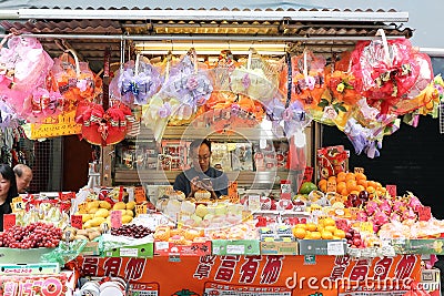 HONG KONG- FEBRUARY 19, 2018-Kawloon - Fruits vendors selling verity of fruits on street market stalls of Hong Editorial Stock Photo