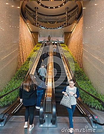 People move on escalators in Two Exchange Square Editorial Stock Photo