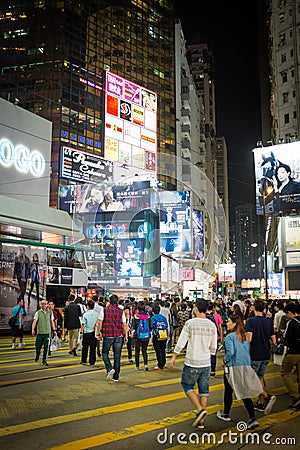 HONG KONG - October 2015: Pedestrians in a crosswalk Causeway Bay district in Hong Kong Editorial Stock Photo