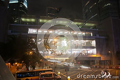 HONG KONG, HONG KONG SAR - NOVEMBER 17, 2018: Bright shiny Apple store in Central Hong Kong at night. There are many people inside Editorial Stock Photo